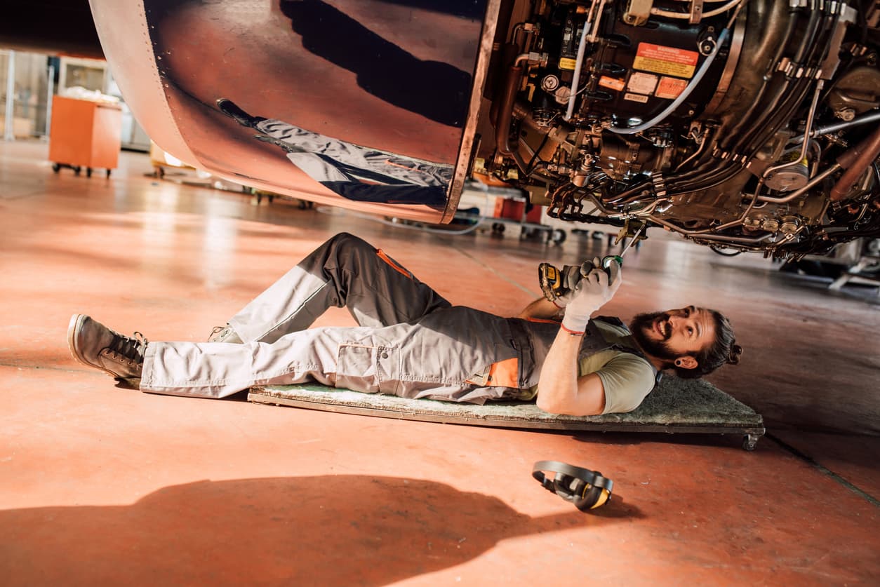 Aircraft maintenance technician performing equipment checks